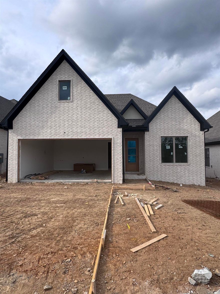 Welcome to Mountain Brook, West Little Rock's newest neighborhood, conveniently located off Highway 10 behind The Ranch. This single-level residence beautifully combines craftsmanship and design, featuring three bedrooms and two baths. The primary suite serves as a sanctuary with a spa-like bath, soaking tub, oversized walk-in shower, and a custom closet. The living room boasts soaring 12' ceilings and a floor-to-ceiling tiled fireplace. At the heart of the home is a chef’s kitchen equipped with quartz countertops, custom cabinetry, a dining area, and a fully functional pantry. You can also enjoy evenings by the outdoor fireplace. The home is scheduled for completion in May 2026. Please contact the listing agent to schedule your private tour.