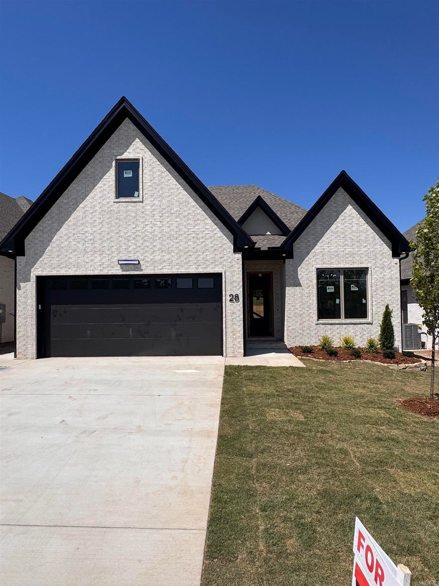 Welcome to Mountain Brook, West Little Rock's newest neighborhood, conveniently located off Highway 10 behind The Ranch. This single-level residence beautifully combines craftsmanship and design, featuring three bedrooms and two baths. The primary suite serves as a sanctuary with a spa-like bath, soaking tub, oversized walk-in shower, and a custom closet. The living room boasts soaring 12' ceilings and a floor-to-ceiling tiled fireplace. At the heart of the home is a chef’s kitchen equipped with quartz countertops, custom cabinetry, a dining area, and a fully functional pantry. You can also enjoy evenings by the outdoor fireplace. The home is scheduled for completion in May 2026. Please contact the listing agent to schedule your private tour.
