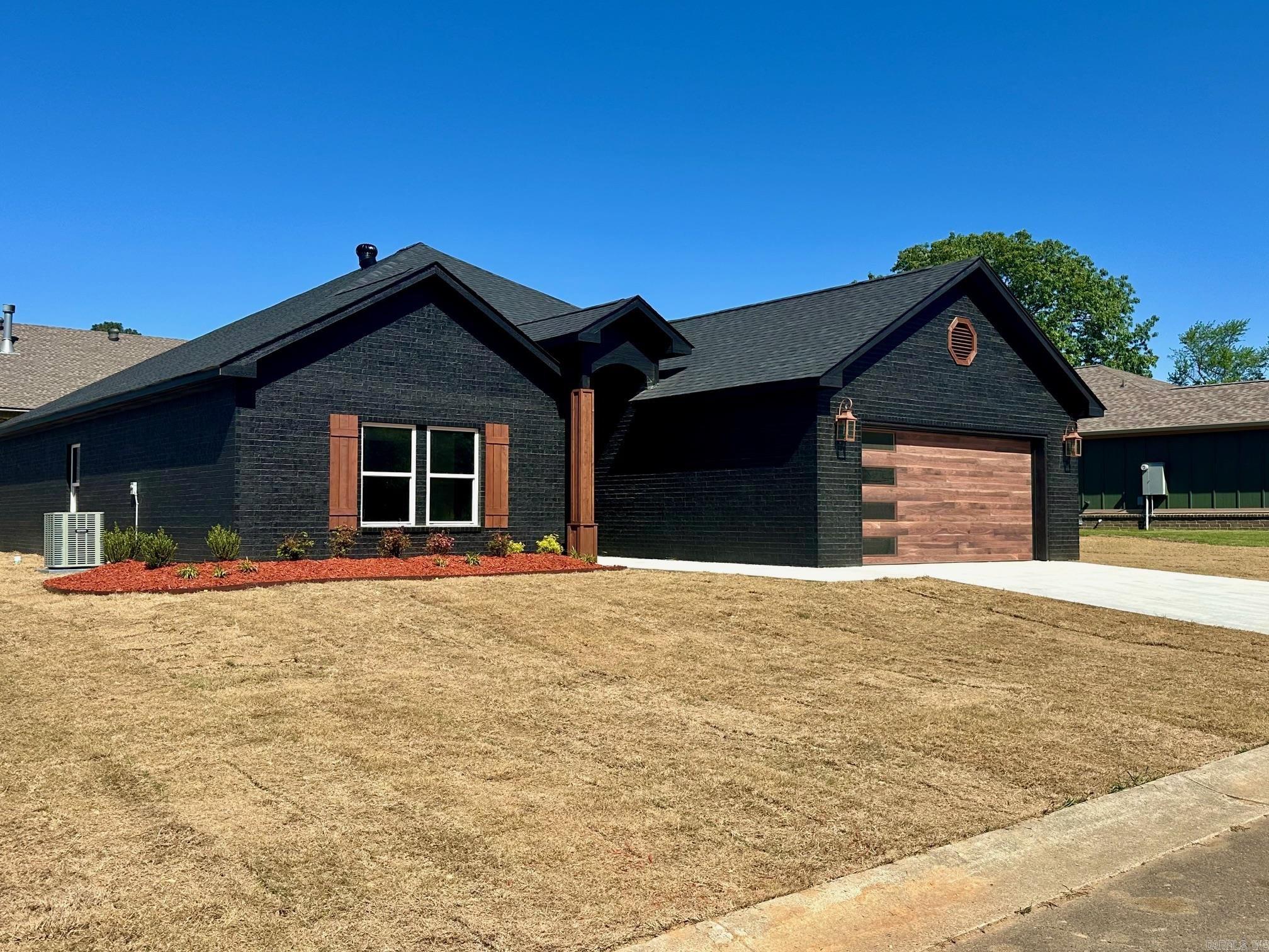 This new construction is perfect for you! It's move-in ready and located in the Lake Hamilton School District. The subdivision is close to the school, which is super convenient. Inside, you'll find vinyl plank flooring and beautiful granite countertops in the kitchen and bathrooms. The soft close drawers and cabinets add a touch of luxury. The primary bath even has his and hers closets! Outside, there's a covered back porch and a new sod lawn. Plus, the community offers a pool and a basketball court for you to enjoy. And don't forget, there's a 1-year builder's warranty for peace of mind. It's a dream home!