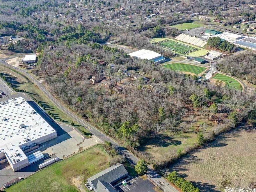 Prime Location! 2.5 acres near Oaklawn Racing and Casino, hospitals, shopping and schools with many opportunities and use possibilities. Rezone for commercial use. Blue land square in pictures is approximate and for general location purposes only. Please refer to legal description.