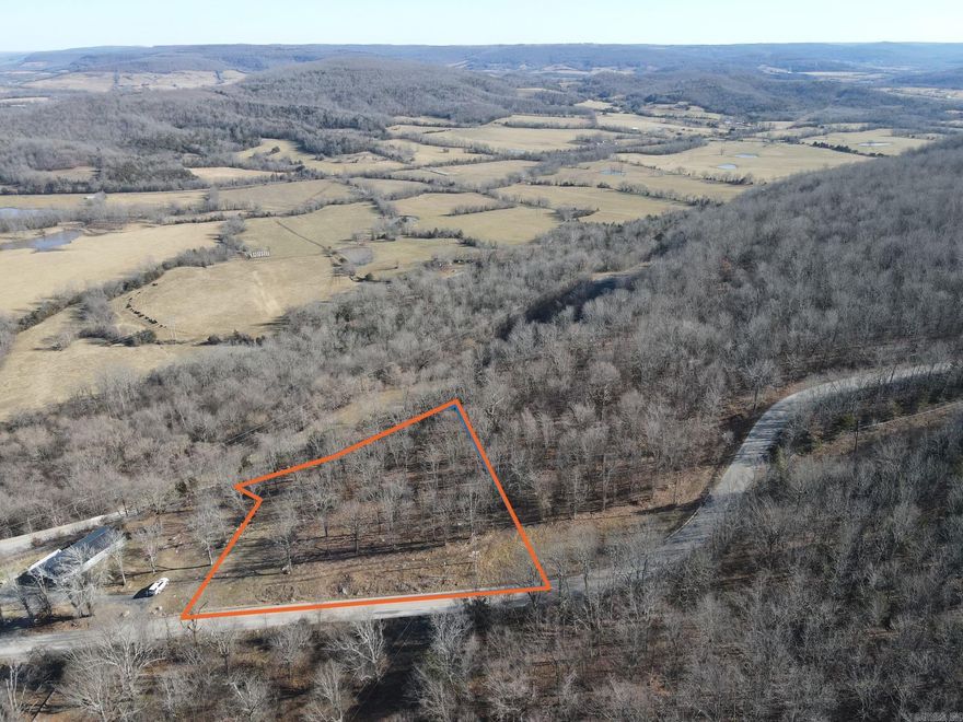 This picturesque property spans 1.34 acres and offers breathtaking panoramic views of the stunning Backbone Mountain and the serene Cove Creek Valley. Nestled just outside the charming town of Marshall, Arkansas, this parcel of land has been partially cleared to maximize its potential and showcase the mesmerizing vistas. With its prime location and captivating scenery, this property presents an ideal opportunity for anyone looking to build their dream home in a tranquil and visually stunning environment. Owner Financing Possibilities!