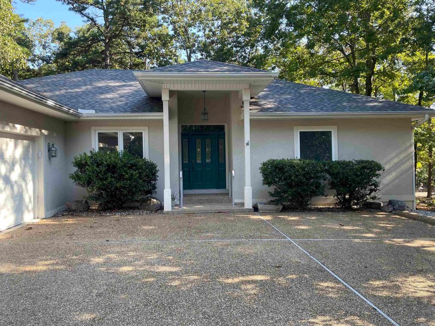 Beautiful and Modern 3BR 2 Ba Home w Thoughtful Improvements by Owner. New Hardwood and Tile Floors Throughout.  New Stacked Granite Fireplace w unvented new logs.   New Roof in 2023. Samsung Refrigerator and 2023 Stainless Steel Dishwasher and Gas Stove New Granite and newly Painted Kitchen Cabinets as well as walls and trim. Back Deck has new handrails & steps. And New Screened area has Ceiling fan. Table and Chairs.. Ready for Dining.  5 Ft Fence Newly installed in Backyard. New Flagstone Patio area with Stepping Stones.  Privacy & Pretty Forest view at back. New Refill for Propane tanks in May 2025.   Large Garage w new Remotes.  One Time Buy-In Fee for those who do not already own property in HSV.