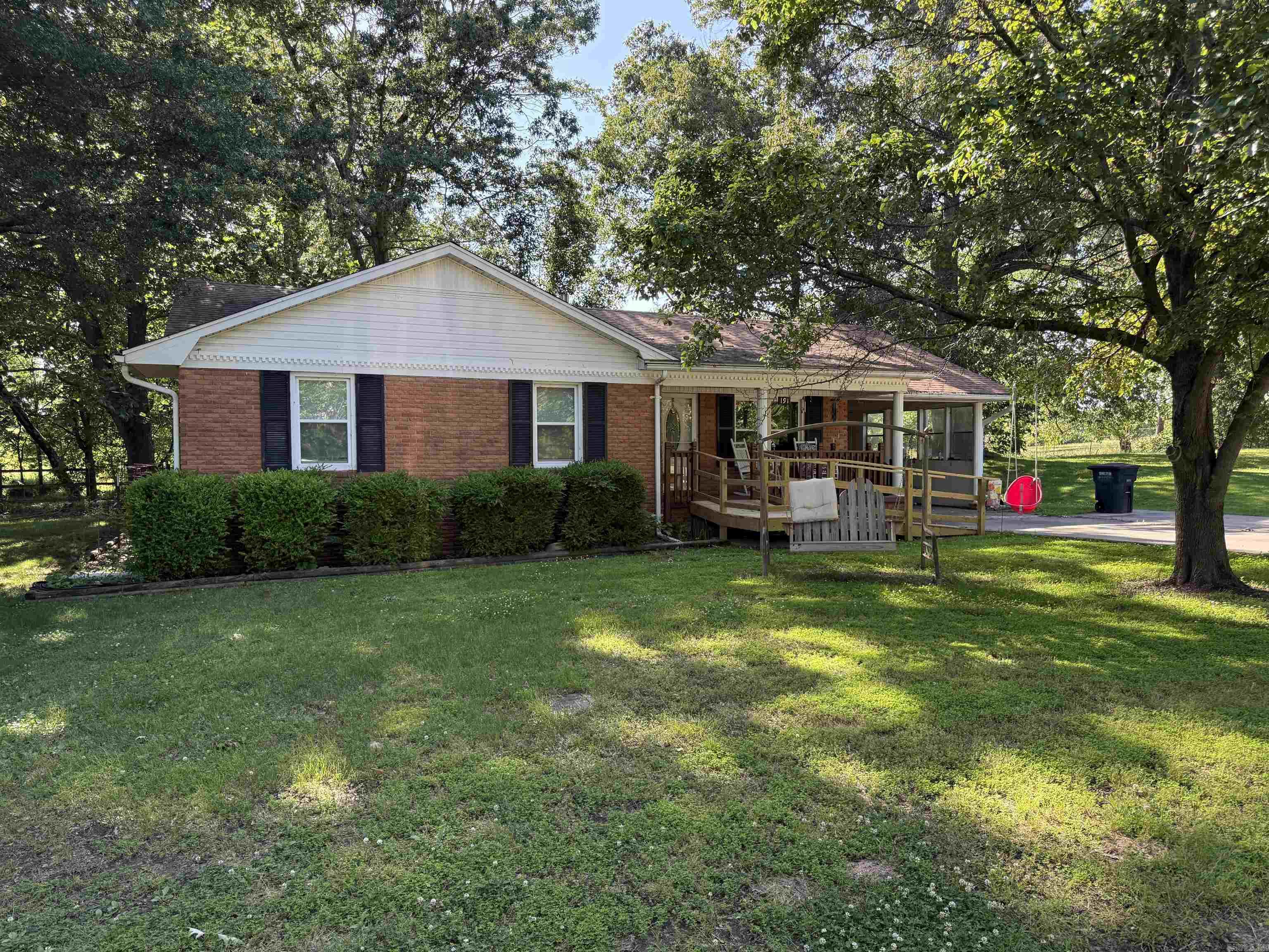 Charming Home on a Quiet Road – 191 Mayo Dr, Piggott, AR Welcome to this beautifully maintained 3-bedroom, 2-bathroom home tucked away on a quiet street in Piggott. Nestled on nearly half an acre, this 1,560 sq ft home offers peace, privacy, and plenty of outdoor charm. Step outside to enjoy a spacious deck surrounded by mature trees – perfect for relaxing mornings or entertaining evenings. Inside, you’ll find a comfortable and inviting layout featuring a mix of tile and carpet flooring, central heating and air, and a well-appointed kitchen. Additional features include an attached garage plus a detached garage, giving you ample storage and parking. Whether you’re looking for a forever home or a peaceful retreat, this property is a must-see. Contact Forrest Realty today to schedule your private showing!
