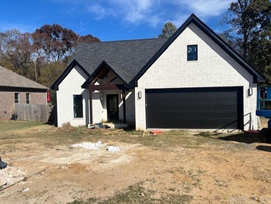 ALMOST COMPLETE ! NEW CONSTRUCTION in established BASE MEADOWS subd that borders LRAFB, on the Sherwood side of Jacksonville and closest street to back gate entrance to LRAFB! All brick construction on oversized lot w/ greenspace at the rear. Home is an open, split bedroom plan. Primary BR/BA main level. 2nd BR(flex room) and 1/2 BA also on main level. 2 BR 1 BA upstairs offering lots of privacy. Convenient all electric home, no gas bill! LVP flooring throughout. Quartz countertops and backsplash. Spa like master bath w separate shower, soaker tub, and clerestory window. Upgraded SS appliances including INDUCTION COOKTOP....a cleaner, safer alternative to gas. The only new construction available in this popular subdivision!! AGENTS SEE REMARKS