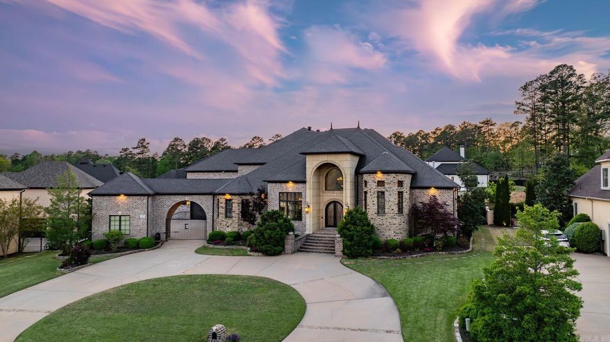 Welcome to 106 Orle, where Tuscan-inspired elegance meets relaxed luxury in one of Chenal’s premier gated neighborhoods. Step into the grand two-story foyer with hand-painted frescos, giving an artistic and warm touch to the living spaces. This chef’s kitchen is made for entertaining,with double islands, premium appliances, and a wet bar.  A private main-level guest suite offers a space for visitors, complete with its own sitting area and ensuite bath. The primary suite features a separate living area perfect for a wellness room, office, or library highlighted with a three-way glass fireplace . A serene spa like bath and dual oversized closets add to the abundance of this suite. Upstairs multiple spaces offer endless possibilities, including two guest suites each with their own ensuite bathroom, a theatre room with a built-in bar, a second private office with an attached covered balcony, and a work out or playroom.  Your private outdoor oasis—with a full kitchen, hot tub, and peaceful fountain is the perfect place to entertain. And for golf lovers, drive your cart directly from your garage to private access of the 18th hole of the Bear Den Course at Chenal Country Club.See remarks
