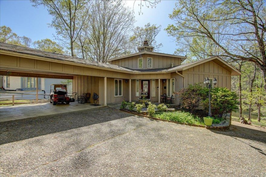 Beautiful Lake Segovia Home! Come see this fantastic 3 bedroom, 3 bath home conveniently located close to the West Gate in Hot Springs Village! Each bedroom has its own private ensuite bath, with 2 of the bedrooms & baths downstairs and the 3rd bedroom & bath are a private retreat upstairs. You'll love the open living & dining area and you'll want to stay all day in the spacious sunroom overlooking the lake. The living area boasts soaring ceilings and a wood-burning fireplace/stove insert for a cozy space for those cold or snowy days. Recent updates include new flooring in the kitchen, master bedroom & Bath & sunroom, 2 new HVAC units (2023), new kitchen appliances, new water heater, updated plumbing, and ADT security system. Enjoy sunsets & gorgeous lake views from 2 decks and a lower level courtyard/patio. Tons of extra storage in the lower basement/workshop (unfinished). New roof in 2021. There is a $1500 one-time buy-in fee for first time buyers in Hot Springs Village.