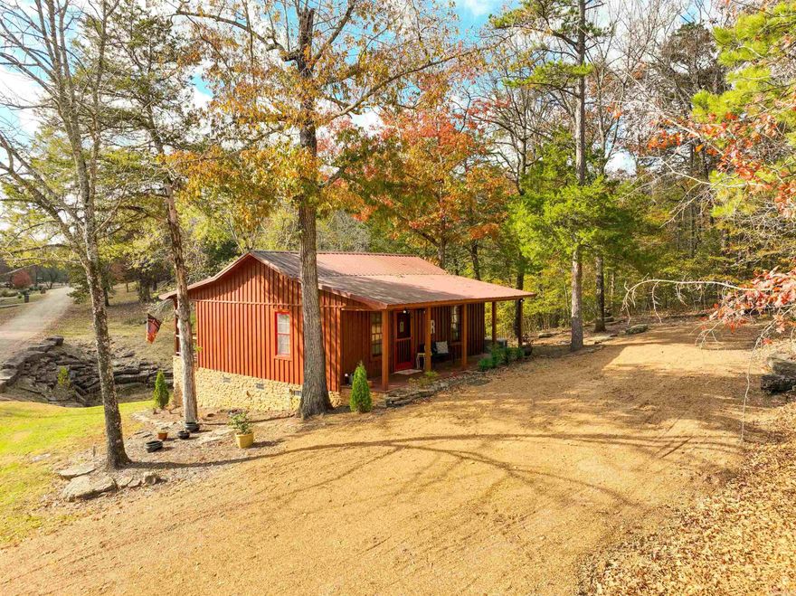 Turnkey, Fully Furnished Cabin in private gated subdivision on the Little Red River! Enjoy a beautifully updated 2-bed, 1-bath cabin in a gated community with a pool, boat ramp, and dock. This retreat is truly move-in ready with major upgrades: new flooring, refinished wood walls, updated electrical, new shades, renovated bathroom, improved kitchen features, added insulation, fresh siding/paint, re-graveled driveway, porch lighting, landscaping, automatic emergency backup generator, and more. Just minutes from Greers Ferry Lake.  Your perfect river getaway is ready to enjoy!