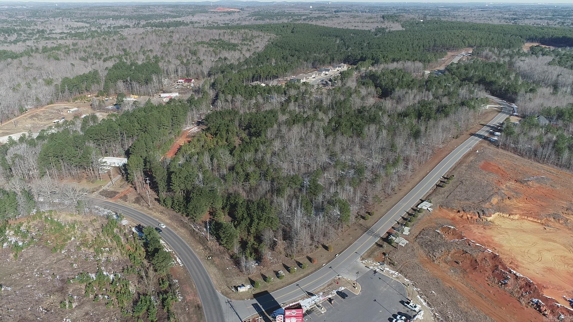 Don't miss out on this remarkable opportunity that awaits you in Saline County! We are thrilled to present an exceptional property, spanning across 10± acres in Alexander, at the entrance of Parkway Trails. This wooded parcel boasts convenient access off West Sardis Road and Parkway Trails located strategically across from the new Circle K, making it an incredibly desirable location. If this piques your interest and you desire to explore the potential that this property holds, we urge you to take action and reach out to us. Our dedicated team is eagerly waiting to assist you with any inquiries you may have. We are committed to providing you with all the additional information you need to seize this incredible opportunity. Don't hesitate, give us a call today!