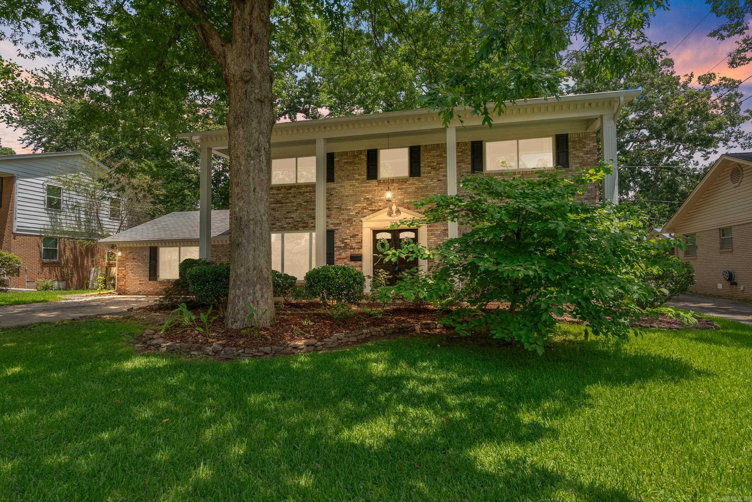 Don't miss the updates on this elegant Midtown home! Nestled on a peaceful yet convenient tree-lined street, 705 Legato Dr. welcomes you with its column-lined, two-story front porch. Once inside you won't be able to take your eyes off the stunning custom-built wooden spiral staircase. The foyer is bordered by a cozy den on one side & living room on the other. The updated kitchen boasts freshly painted cabinets (with built-ins), a striking backsplash, quartz countertops, a brand-new dishwasher, & black stainless-steel refrigerator, gas range, & microwave. The main floor also features a large bonus rm, formal dining rm, laundry rm, & updated 1/2 bath. Upstairs, the primary suite awaits & the completely remodeled primary bath is a must a must see! Four generously sized bdrms & guest bath are also located on this floor. Off the kitchen, a covered patio & home spa overlook the flat, fully fenced backyard, which also features a storage building that could be made into a home office, gym, or workshop. Additional updates include newer windows throughout, luxury vinyl flooring downstairs, new carpet upstairs, & much more (see update list). This house is a rare find for under $300K!!