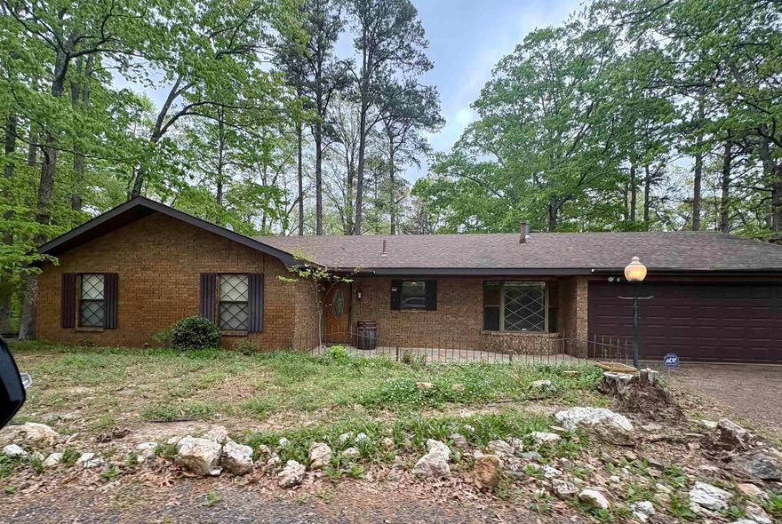 Check out this 3/2 brick home tucked back into a beautiful 6.27 acre property! With a peaceful rustic feel, you still have the availability to make it your own. The living room has new floors, beautiful vaulted ceilings, sliding doors leading to the large back deck, and a door leading to the spacious sunroom which also leads to the craftroom. There are FOUR buildings outside for ample amount of extra storage. Don't miss this opportunity to be on acreage right outside the city. *** Agents See Remarks ***