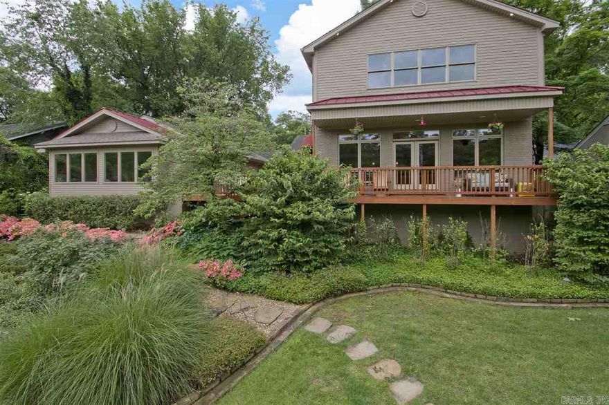 Beautiful home with wonderful floor plan that has two separate living areas perfect for separate children's wing or as  In-Laws quarter. Original home remodeled in 2009 and Western addition built in 2001.  Addition offers a very open floor plan with walls of windows. Beautiful hardwoods throughout, neutral color tones, top of the line appliances, designer lighting and so much more. The beautiful landscaping and privacy only add to this homes appeal.  MANY FURNITURE ITEMS CAN CONVEY WITH ACCEPTABLE OFFER.