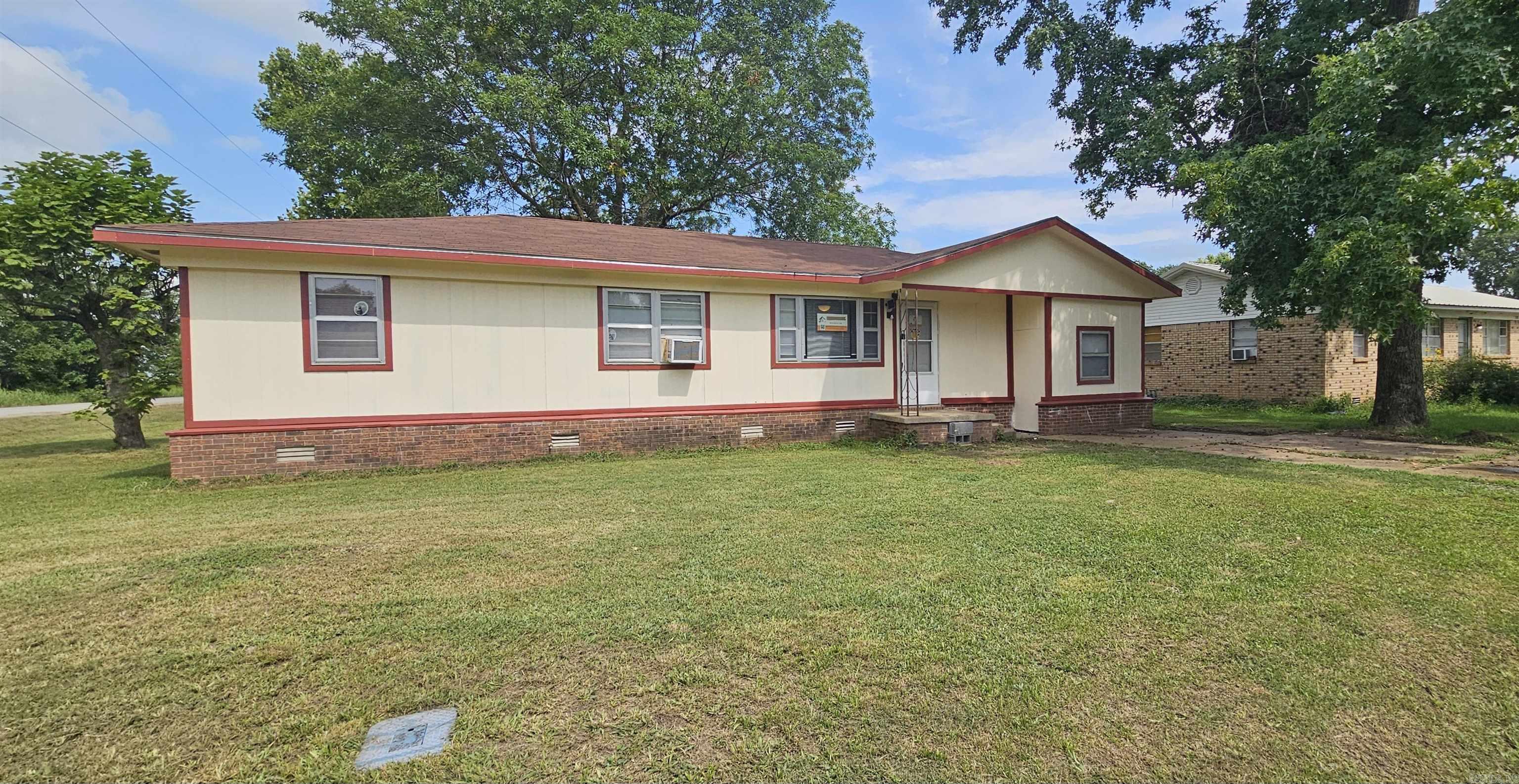 Discover this beautifully renovated home in the heart of Hoxie, Arkansas! With a new roof added in 2024, this home boasts fresh upgrades including brand-new floor coverings, modern interior and exterior paint, updated light fixtures, and completely new plumbing in the kitchen and bathroom. The kitchen is equipped with a new, natural gas oven range, refrigerator, and a new hot water heater, making this home move-in ready. Nestled on a spacious corner lot with mature trees and city utilities, this property offers a serene setting with plenty of room to enjoy outdoor living. Just a short drive from Jonesboro, Lake Charles, and various conveniences, this home combines small-town charm with easy access to nearby amenities. It’s the perfect blend of modern updates and cozy living—schedule a tour today!