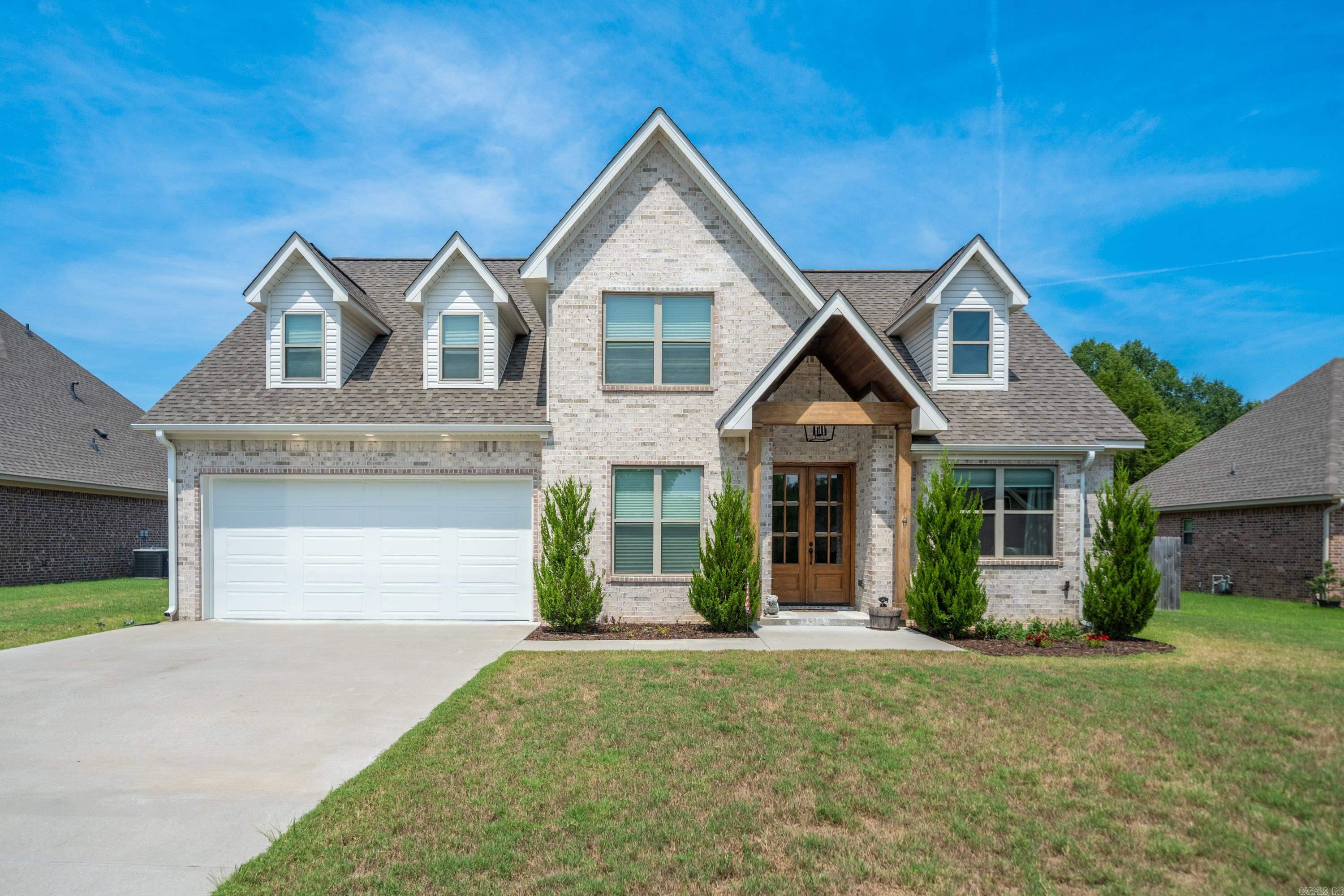 Modern Rustic Dream Home in Lakeside School District. Built in 2022, this stunning two-story modern rustic home offers the perfect blend of cozy charm and upscale design. Ideally located just 5 minutes from Oaklawn, 10 minutes from Downtown Hot Springs, and 45 minutes from Little Rock, youāll love the convenience of this safe neighborhoodāplus, thereās no HOA! Spanning 2,829 sq. ft., this home boasts 5 bedrooms, 2.5 bathrooms, an office, and a huge den, all crafted with custom details and thoughtful finishes. The open-concept main level features rustic wood beams, an all-rock gas fireplace, live-edge countertops, and numerous windows that fill the home with natural light. The vaulted master suite is a true retreat, complete with an oversized soaking tub, walk-in shower, and private toilet room. A spare bedroom and office are also located on the first floor. Upstairs, youāll find a 500 sq. ft. bonus room, plus two additional bedroomsāone with a spacious walk-in closet. Kept in immaculate condition and built with no expense spared, this property is move-in ready and waiting for you to call it home!