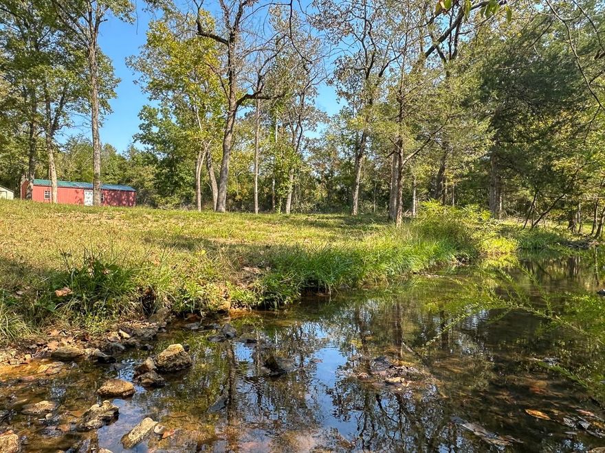 A Rare Opportunity To Own A Private Wooded Oasis! This stunning 20 acre +/- property offers the ultimate in outdoor living. You will enjoy hiking, hunting, hilltop views as well as the tranquility of an easily accessible year-round creek. It’s just a small hike or ride on your side-by-side to your very own lake lot located at the end of a private, approx., 13 acre.  The property features a recently painted 14x40 cabin, pre-wired for electricity, a 28-foot fifth wheel with a slide-out, and a brand new 10x16 shed for all your storage needs.  Whether you're a hunting, fishing, or ATV enthusiast, this property has it all. Electricity, High Speed Internet and city water is conveniently available at the road. With its endless potential, this unique property won't last long. Don't miss this incredible opportunity; call today!