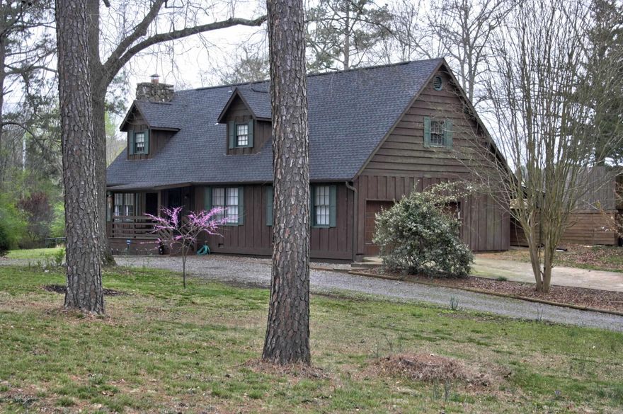 This charming 3 bed / 2 bath home sits on an expansive, nearly 2 acre corner lot, offering ample space & tranquility, just outside the Searcy city limits. The inviting living room, features hardwood floors & a large, wood-burning fireplace, perfect for cozy evenings. The kitchen boasts plenty of cabinetry, with upper cabinets on one side & open, display shelving on the other, enhancing the open, airy feel of the space. Corian countertops & stainless appliances add a touch of modern functionality. The primary bedroom suite, conveniently located on the main level, offers a tiled, walk-in shower w/ frameless glass doors. Venture upstairs to discover two additional guest bedrooms, along with a versatile playroom/bonus room adjacent to one of the bedrooms. With a window & closet, this bonus room could easily serve as an add’l bedroom, though accessed through another bedroom. Step outside onto the large elevated deck, offering ample room for entertaining or dining, while enjoying views of the above-ground pool. For added convenience, this home features a 2-car side-entry garage, complemented by an add’l circle drive in front of the home, providing plenty of parking space for guests.