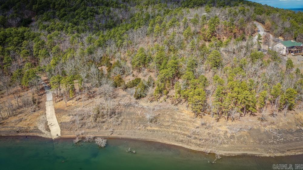 This unique gem is a rare find!! Lake front land ready for you to build your dream home. Property backs up to corp property with a subdivision boat ramp. What more could you ask for. It's a must see!!