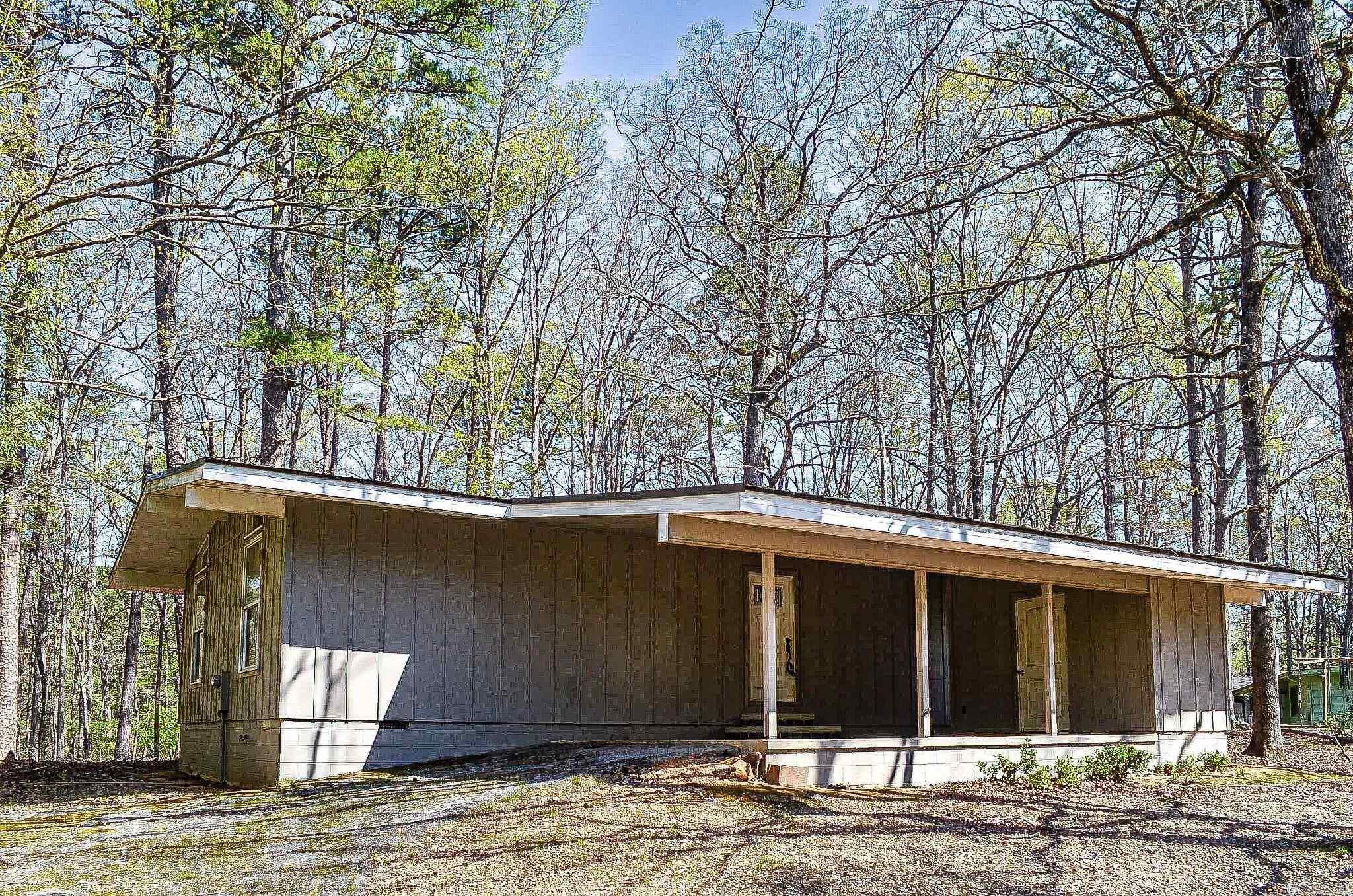 Surprise......the build date may say 1971 but this charming 2 bedroom 2 bath home has been totally renovated. Redesigned kitchen and both baths. Upgrades include granite counters, custom cabinets, wood floors, upgraded appliances, energy conscious windows and even a metal roof. Transoms above the French doors to the deck. Vaulted ceiling, upgraded ceiling fans and electrical fixtures. Hot Springs Village Property Owners Association has a new member buy-in fee of $2,000.00 due and collected at closing.