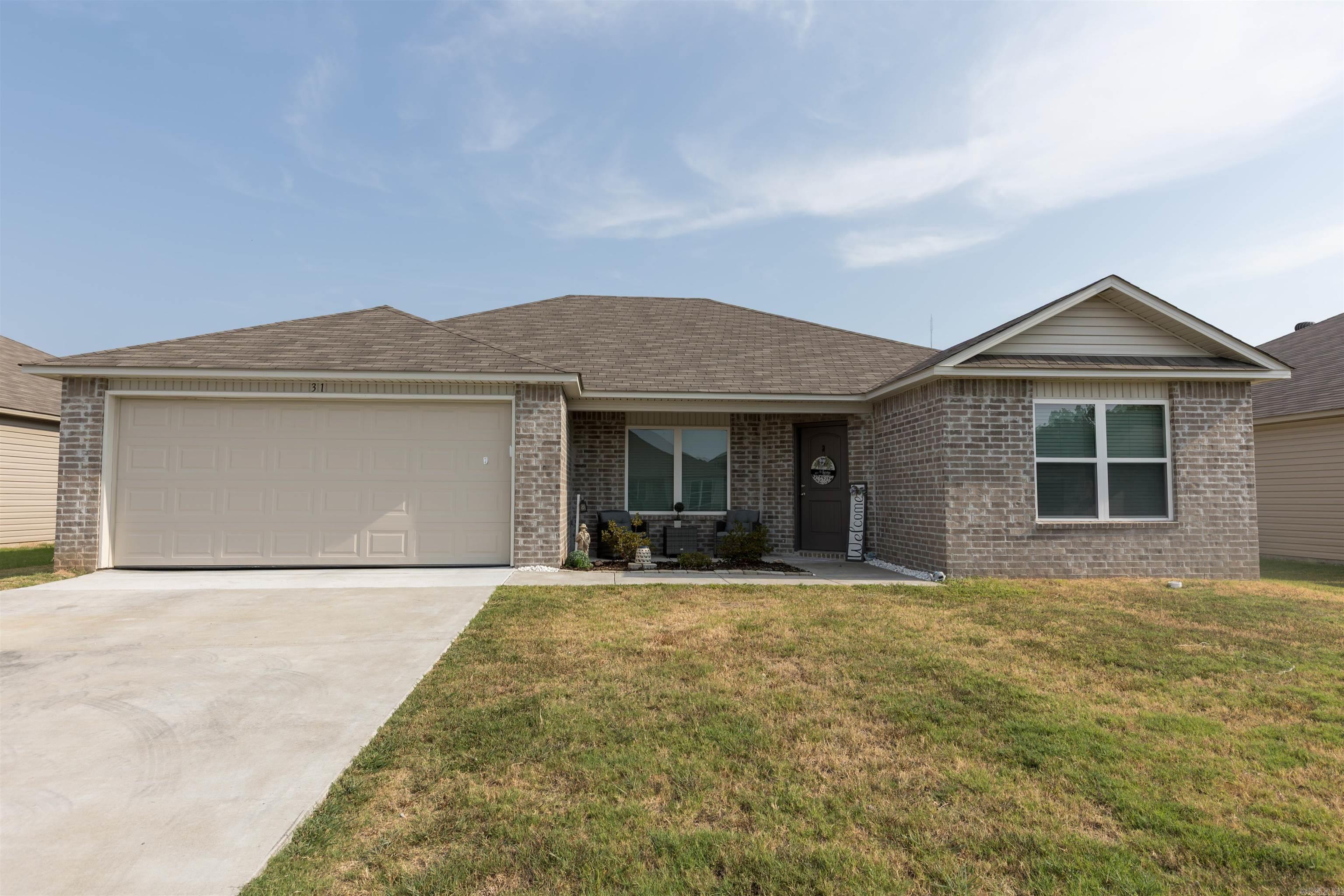 This home is BEAUTIFUL and built in 2023 - with a GREAT floor plan! Features 4 bedrooms and 2 bathrooms, with the primary bedroom being separate from the other 3 rooms. The backyard is fully fenced with a wood fence. Solar lighting has been added in the backyard, with lights that can change colors. PLUS, there is a storage building that will stay with the home. There has been a fireplace feature added to the home, adding warmth and charm! Enjoy a maintenance free home with plenty of space inside and outside for your family! This property is eligible for a USDA Rural Development 0% down payment loan. Contact your preferred lender for qualification details!