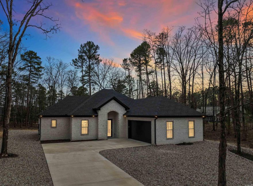 All-Brick New Construction on Cul-de-Sac! Beautiful 3BR/2.5BA home with 2,150 sq. ft. on a level lot less than 2 miles from the East Gate. The open-concept floor plan is filled with natural light and features a cozy gas fireplace. Each bedroom includes its own ensuite. The spacious primary suite offers a tray ceiling, walk-in shower, and a relaxing soaker tub. Quality finishes throughout, including custom blinds, storm doors, remote garage access and a partially floored attic for added storage. Enjoy quiet mornings on the back patio in a peaceful setting. Located near dining, pickleball, tennis, hiking trails, and the beach. Experience the vibrant lifestyle this community has to offer—where comfort meets convenience.  ----See Video Attached to Listing---- Agents see remarks--- Furniture, Washer, Dryer and Security System may be purchased separately---