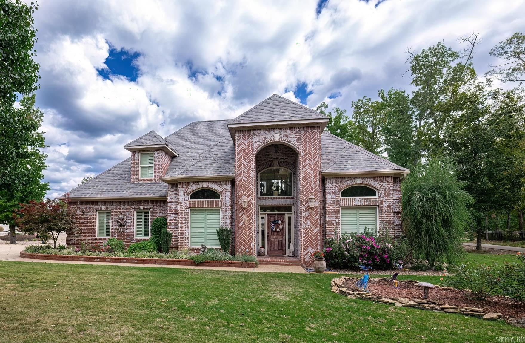 If you are ready to enjoy all that this beautiful Village has to offer, then this is your perfect home! It sits on an oversize. corner lot with great views from the front porch - to the rear deck and spacious patios. The Granada Golf course is ranked among the top ten courses in the state by Golf Digest. You might find that this is the perfect spot for social gatherings, there is plenty of room for that, inside or out. From the moment you enter you will note the extra touches and custom millwork. There is an office/library and a formal dining room that flow into the open living room, breakfast room and spacious kitchen. The primary bedroom has a sitting area, a luxurious ensuite complete with a jetted tub and fabulous custom shower. The more than ample closet won't disappoint, either. Up the curved staircase, is a wet bar/game/entertainment space with deck access.  The two bedrooms up, share a Jack and Jill bath.  The golf cart garage, features a safe room. The 2 car garage has loads of storage. Beautiful landscaping and wide circular driveway, with plenty of parking (when friends and family come to visit) Add all that together, and that makes this a great place to live.