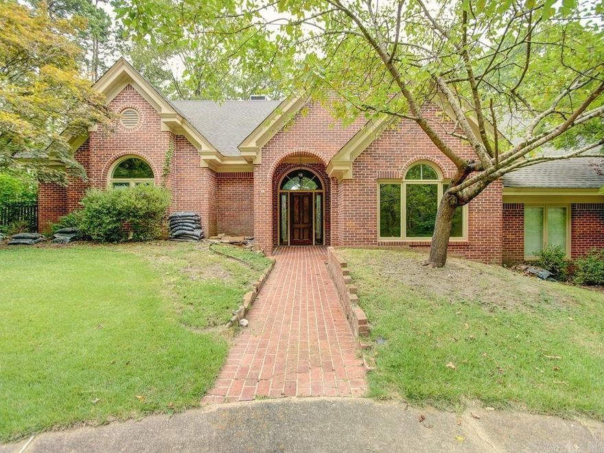 Discover your dream home with this stunning 4,358 square foot, two-story brick residence, perfectly situated on Saline River frontage with breathtaking seasonal views. This exceptional property features a side-load 4-car garage, ensuring ample parking and storage space. Inside, you'll find vaulted ceilings and a chef's kitchen equipped for culinary excellence. The home boasts a mix of hardwood, tile, and carpet flooring, providing both style and comfort. Enjoy cozy evenings by the wood-burning fireplace, with gas starter, in the spacious living area. With 4 bedrooms and 4 bathrooms, there's plenty of space for everyone. Additional highlights include bonus rooms, an office, a principal bedroom suite with walk-in closets, a laundry room, and a formal dining room. Step outside onto the expansive decks and take in the serene surroundings. Located at the end of a private street, this home offers the perfect blend of tranquility and luxury. Don’t miss this rare opportunity to own a piece of paradise on the Saline River!