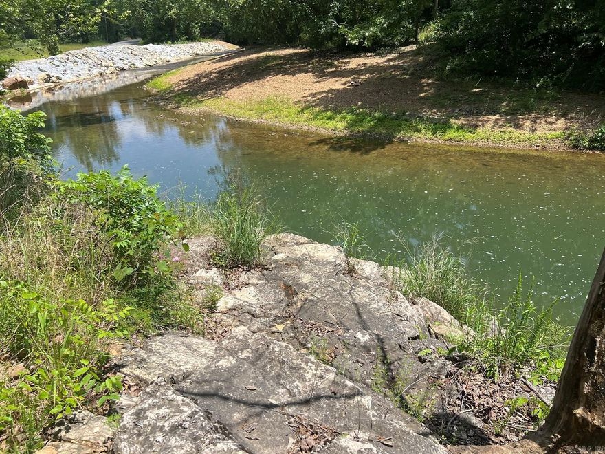 CREEK/CAMP/HUNTING/RECREATIONAL  Plus more opportunities on this 26.25 Acres with Pine Hill Creek running right through. Frontage on both sides of the creek.  Nice level shaded camping area over looking creek were a rock ledge provides a perfect place for the kid’s jump in and take a swim. Acreage is mostly woods with some nice oak trees with various homesites. Good county road frontage easy access. This is truly one of a kind.