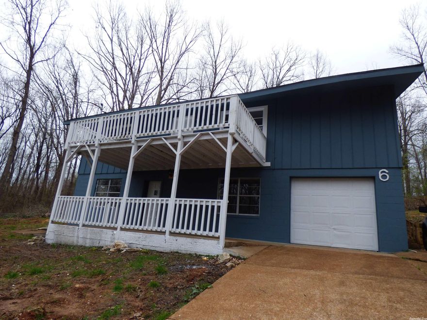 All new interior.  This home was recently renovated, all new flooring, new paint, new fixtures, new tile. Beautifully designed with living room, master bedroom, full bath and laundry room on the lower level, upstairs you have a open den/living room and kitchen with a deck overlooking the front, 2 bedrooms and full bath. Very efficient heat/air room units with remote controls. Appliances to be installed before move-in.