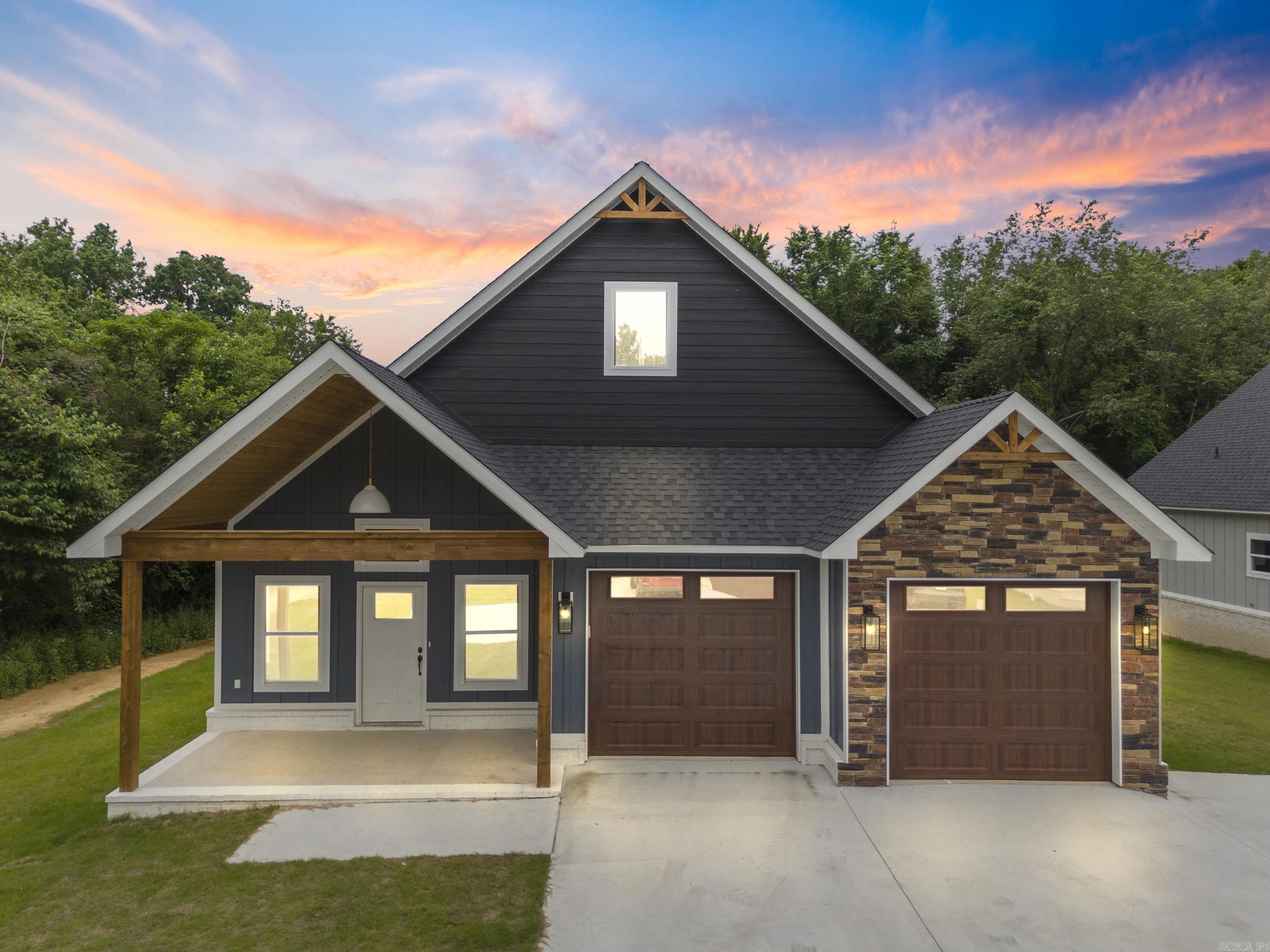 This gorgeous new construction by Millco Enterprises has custom details throughout. Step inside and be greeted by vaulted ceilings that create an airy, open atmosphere. The luxury vinyl flooring throughout adds both elegance and durability, perfect for families and pets alike. The heart of this home is the expansive kitchen, featuring a large island, custom cabinetry, and sleek quartz countertops that provide ample space for cooking and entertaining. The living area is enhanced by a modern electric fireplace, providing a cozy ambiance without the hassle of maintenance. Statement light fixtures add a touch of sophistication. The convenience of a tankless hot water heater ensures you'll never run out of hot water in your custom-tiled ensuite shower. The low-maintenance yard means you can spend more time enjoying your home and less time on upkeep. Located in the desirable Greenbrier community, this home offers modern luxury and comfort in a serene setting. Don’t miss out on the opportunity to make this stunning property your home. Schedule a showing today! Tax data for land only.