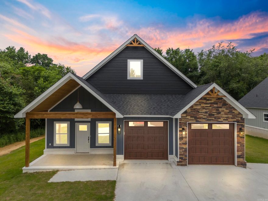 This gorgeous new construction by Millco Enterprises has custom details throughout. Step inside and be greeted by vaulted ceilings that create an airy, open atmosphere. The luxury vinyl flooring throughout adds both elegance and durability, perfect for families and pets alike. The heart of this home is the expansive kitchen, featuring a large island, custom cabinetry, and sleek quartz countertops that provide ample space for cooking and entertaining. The living area is enhanced by a modern electric fireplace, providing a cozy ambiance without the hassle of maintenance. Statement light fixtures add a touch of sophistication. The convenience of a tankless hot water heater ensures you'll never run out of hot water in your custom-tiled ensuite shower. The low-maintenance yard means you can spend more time enjoying your home and less time on upkeep. Located in the desirable Greenbrier community, this home offers modern luxury and comfort in a serene setting. Don’t miss out on the opportunity to make this stunning property your home. Schedule a showing today! Tax data for land only.