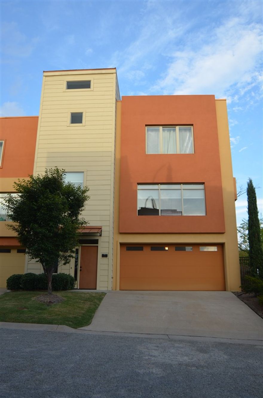 Wonderful downtown location; contemporary row home! End unit includes eco-block construction, 100% energy star qualified home, low-water landscape design, bamboo wood flooring. Energy star stainless steel appliances and lighting, double insulated low E windows, secured gated entry and two car garage. Enjoy your evenings on the deck or your private roof top with incredible views! Rinnai tankless water heater, Daikin HVAC! Property is "single family attached" not condo/townhouse/duplex.