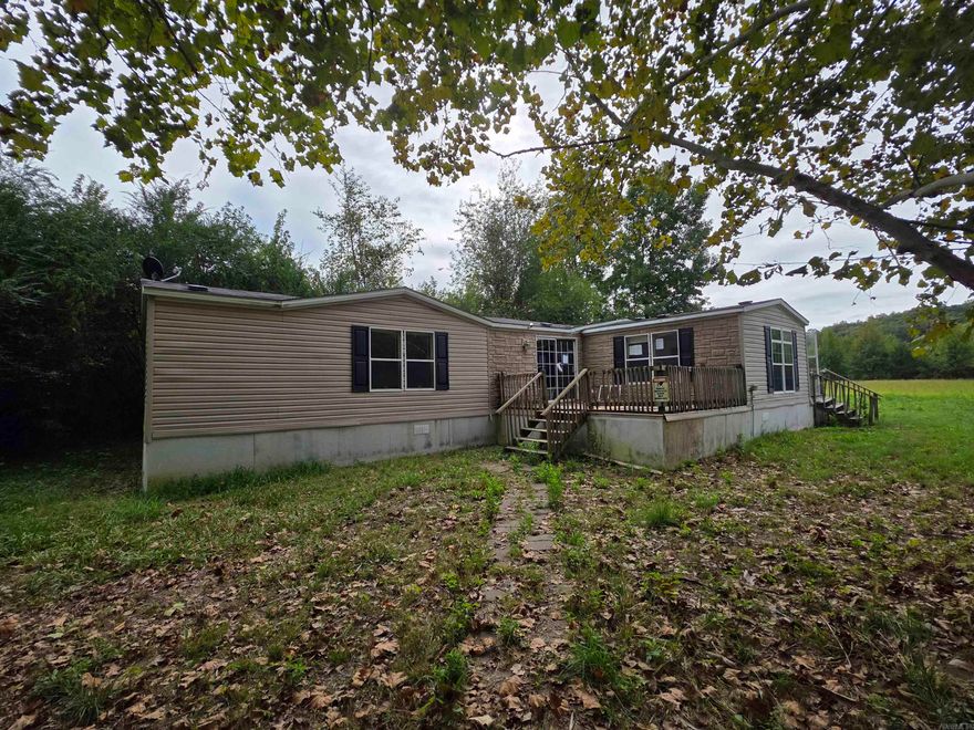 Tucked away on approximately 1.11 acres in the quiet countryside of Vilonia, this 3-bed, 2-bath manufactured home sits on a permanent foundation and offers endless potential. Featuring a split bedroom floorplan, a large open living room, and a spacious kitchen with plenty of cabinet storage, this home is ready for a little TLC to bring it back to life. Surrounded by mature trees and wooded views, the property provides privacy, room to roam, and even includes a storage building. With its peaceful setting and easy access to town conveniences, this could make a great investment, renovation project, or affordable place to call home. Bring your ideas and make this country property shine again! No property disclosure as seller has never occupied the property. Agents see Remarks
