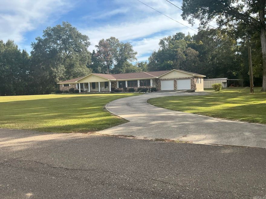 Estate Sale Coming for contents of property, but showings during sale.  Move-in-ready, well maintained Brick home sitting on 6.12 Acres offers so many amenities, it is one you must see.  It features a front porch, large living area with propane gas fireplace open to the dining room with built-ins,  kitchen, lots of cabinets, breakfast bar, & double doors leads to a wonderful back porch with view of backyard, 26X30 shop,covered porch for cookouts, & barn. Three bedrooms with large closets and bathroom are on one end of the house. The large master bedroom suite with large closet & master bath features walk-in-shower, extra room with vanity, a safe room, & doors leading to the back porch, and are located on the opposite end. The laundry room with cabinets, sink is wonderful, one you must see to believe. There is also a side door that leads into a long room that leads to the living room. Great room for kids books, games, etc.  Home also features a safe room with entry from Master Bedroom and exit on sun porch.  The extra large double garage has two storage rooms, exit door leading to the backyard.  The concrete driveway offers extra parking for RV. This home is one you must see.