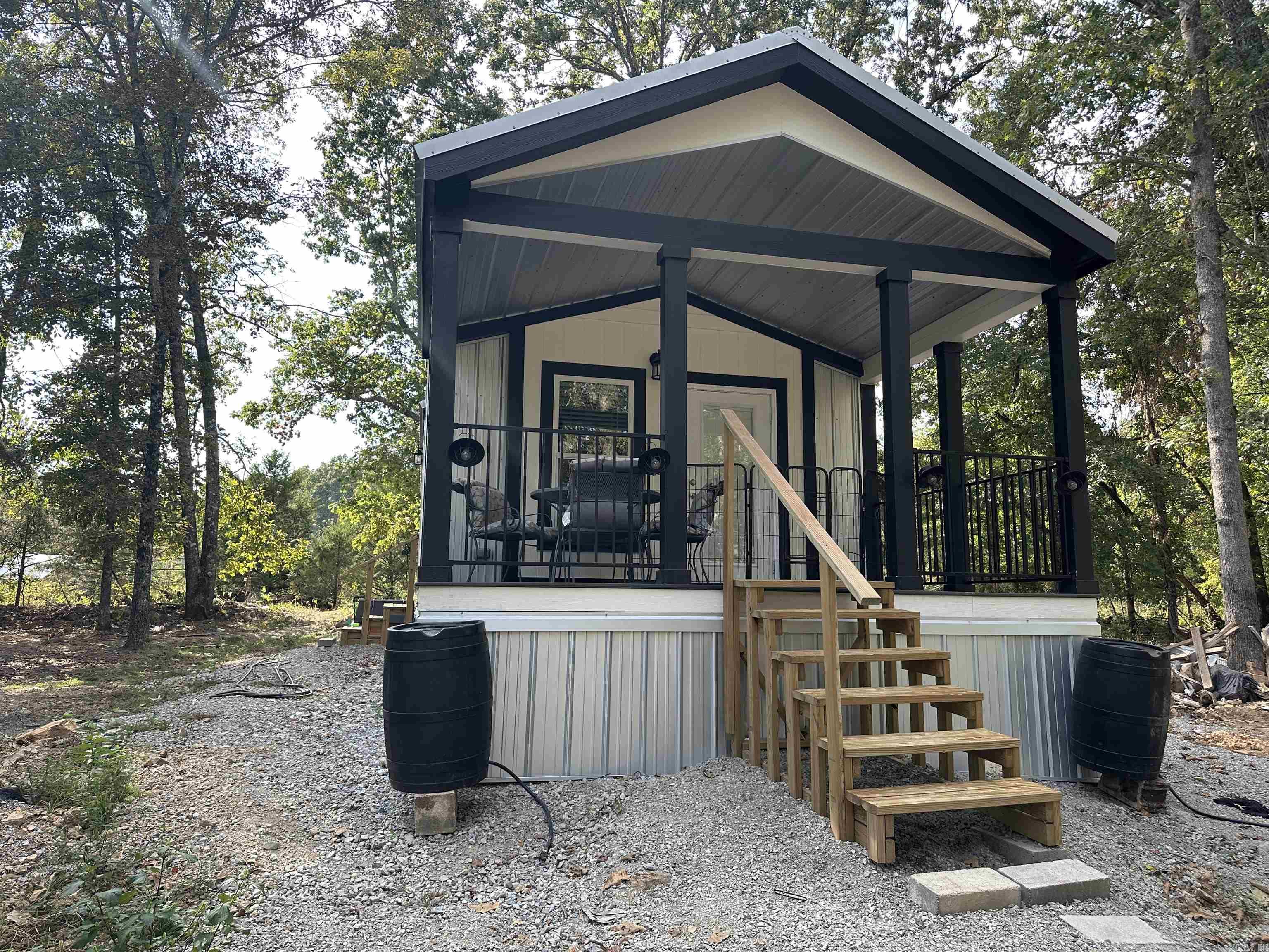 Escape to the country with this adorable new tiny home on 10 unrestricted acres m/l! This property is fully set up with brand-new appliances, a private well, RV hookups, fencing, pond and even a generator—making it the perfect turn-key retreat. The home is built with metal roof and walls for durability and low maintenance, and everything stays so you can move right in. Whether you’re looking for a VRBO rental, hunting camp, summer getaway, or a full-time country escape, this property checks all the boxes. With ample room for hunting on your own land and the infamous White River nearby for world-class trout fishing, the possibilities are endless. Don’t miss your chance to own this rare find—luxury living in the country with endless potential! This one won’t last long!