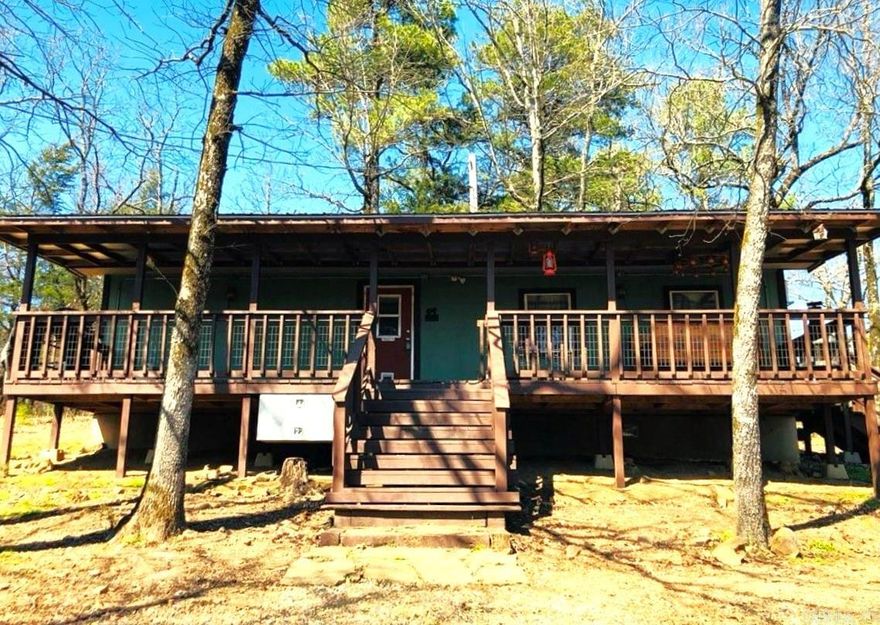 Turnkey!  Perfect getaway!  Cute little cabin in the woods with large front covered deck and side deck.  This modern and adorable cabin has all of the amenities for a weekend retreat, or comfortable living year round for one or two people.  Comes fully furnished, or Sellers will remove any unnecessary items.  The 10 wooded acres offers privacy, even in the winter.  There is an abundance of wildlife, and the mountain views are stunning!  Don't wait.  Won't last long!