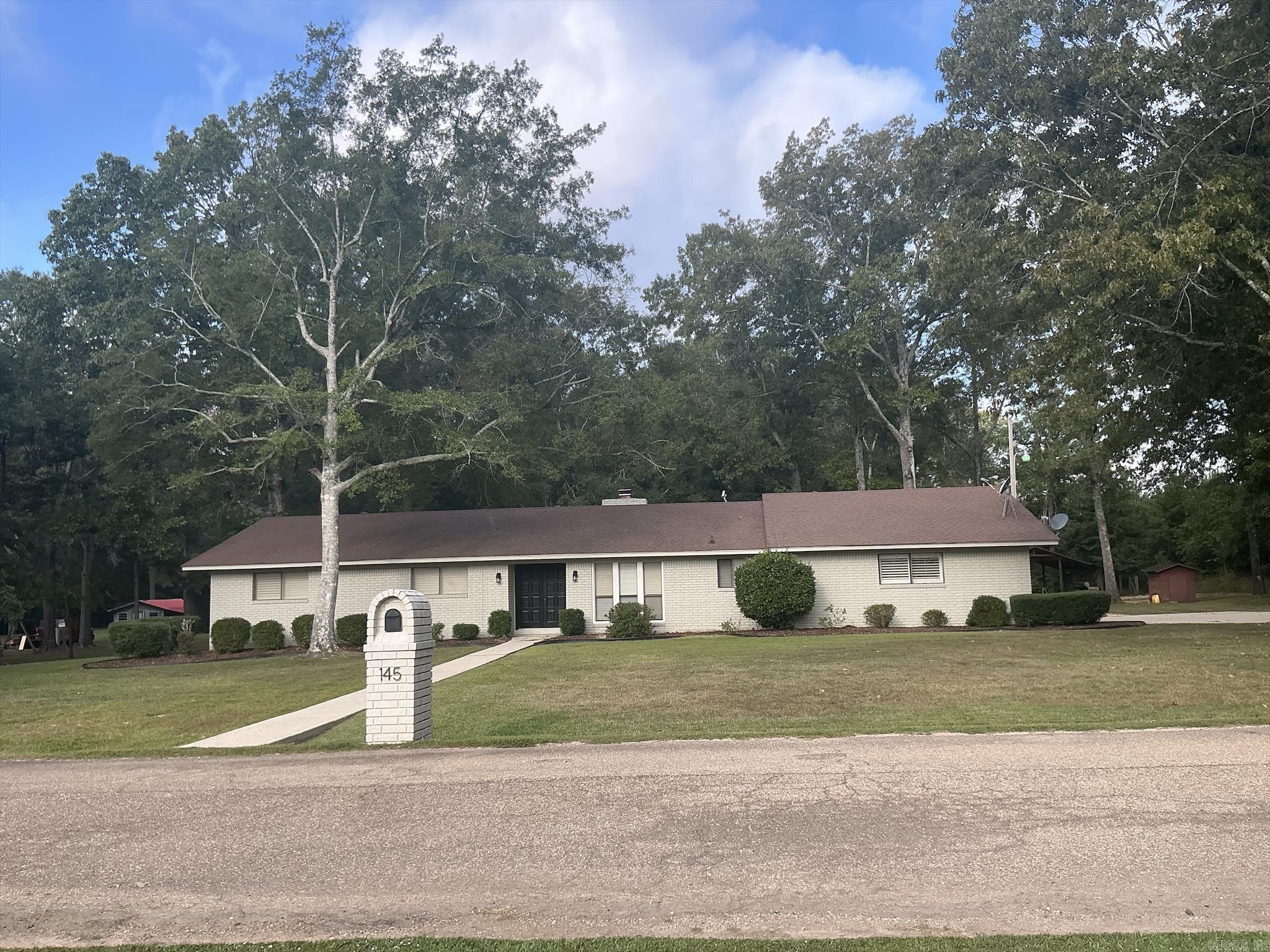 Lovely home sitting on 3.86 acres with 2396 Sq ft featuring large living room with fireplace, 3 bedrooms, could be four since one was converted into a wonderful walk-in closet and could be converted back into a bedroom. Also third bedroom could be a wonderful den, with a door opening on to the deck and great backyard. Home has been remodeled and features 2.5 remodeled bathrooms. Master has large walk-in shower, Hall bath has jetted bathtub, third half bathroom with shower is located next to the laundry room and 3rd bedroom. The large entry hall welcomes you to this lovely home and formal dining room opened to kitchen that has been updated with custom cabinets with lazy Susan’s, spice racks, large pantry and all cabinets have pullouts. Flooring has been replaced throughout the home with custom flooring and lights have been replaced with custom lighting. Also has Double Carport, concrete driveway, 14X24’ shed/shop, covered porch, two wood decks, also wired for hot tub, sellers had a tv on covered porch. In the backyard there is a pole shed and storage building with electricity. Interior has been completely painted with neutral colors just waiting for you and your family.