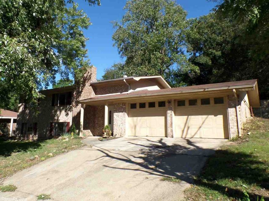 Lovely brick traditional style home conveniently located in the city within the Hot Springs School District. Home features: 1 bedroom, 2 full bathrooms, central heat, central cool, attached 2 car garage, open porch, rear covered deck and fenced backyard. Finished basement includes a den with WBFP, 3 bedrooms, 1 full bathroom and laundry room. HUD Case #031-349446, FHA Financing: IE (Insured Escrow). Property is sold in "as is" condition, no warranties, guarantees or representations.