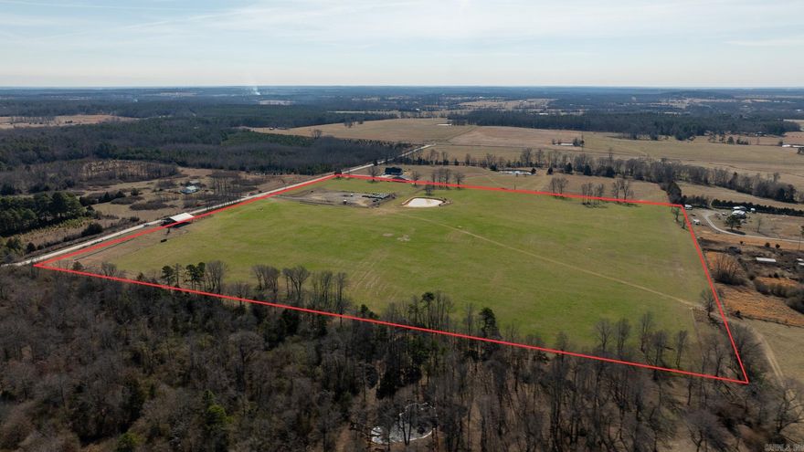 Infrastructure is complete and ready to work!  All cattle working facilities are in place, including a new sorting barn equipped with tub, alleyway, and chute. The holding area is constructed of heavy-duty steel pipe, built for durability and long-term efficiency.  The property also features a pond, a drilled wheat crop currently in place, and a dedicated gravel pad for hay storage. Pastures have been limed and fertilized, promoting strong forage production. With approximately ¼ mile of Carter Rd. frontage, access is easy and convenient.  Several outstanding building sites sit just off Carter Rd., surrounded by new construction in the immediate area — offering an excellent opportunity to build your home while maintaining a fully functional livestock operation.  Additional adjoining acreage is available, with a fenced alley connecting the two properties, creating a seamless expansion opportunity to grow your farming operation and increase your overall footprint.  (No minerals.)