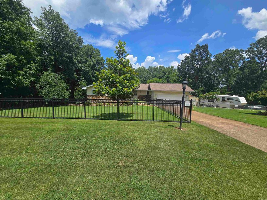 Immaculate 2 bed, 2 bath home on 1.75 AC M/L with seasonal views of Crown Lake. This beautifully maintained home features vaulted ceilings, LVT flooring, energy-efficient 2x6 walls, replaced roof 2023, new windows, and fresh paint throughout. The updated kitchen includes all-newer stainless appliances, including an induction cooktop, and a convection oven. The spacious heated/cooled sunroom offers stunning views of the rock-landscaped backyard and Crown Lake. The primary bedroom includes custom built-ins in the walk-in closet. Additional features include a large pantry, extra storage in the crawlspace, a basement workshop (could be used as a third bedroom), and a 50 amp RV hookup. Two sections of the yard are fully fenced, with separate areas for front and back. Lake access is just down the main road. Storm shelter in the garage and a general automatic whole house generator convey. Listed at $263,000.