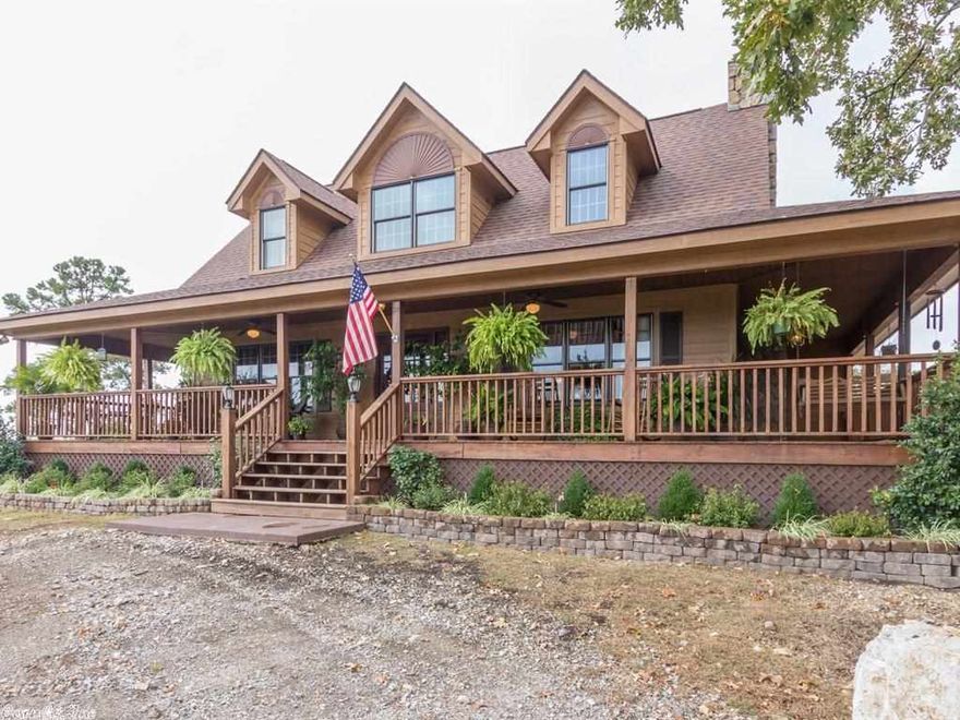 Above the Rest of the World...Is how you'll feel in this spectacular home. This mountaintop marvel is a palace in the "sky" located just minutes from downtown Hot Springs National Park. One of the choicest sites in Hot Springs offering magnificent four season changes to delight and energize the soul. Panoramic mountain vista views with fabulous sunrises and sunsets. Large wrap around porch  for entertaining and viewing the splendor! landscaped with flowering shrubs and a soothing fountain. On 8 acres.