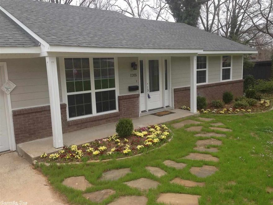 New Everything!  Open floor plan features new hardwoods, new kitchen cabinets, granite counter tops, new lighting, and new stainless steel appliances.  New built in entertainment center in large down stairs family room is a perfect man cave or play room that opens into the screened in patio.  Updated baths with marble tile. New Fence.  New Roof.  New Doors inside and out.  New Energy Efficient Windows.  Blocks away to Idlewild Park and the lake.  Minutes to shopping or downtown.  Your new home! Agent Owned.