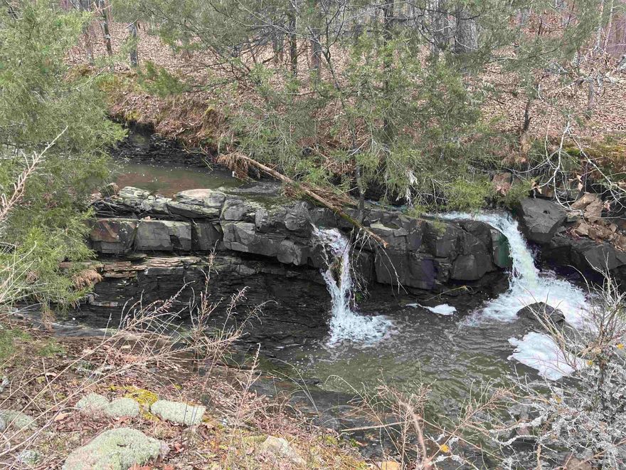 4.18 acres - Nice, wooded, corner lot in Lake Mena Subdivision that would make a great building site.  View of Mena Lake from the spill way which makes a nice seasonal creek on property. Briar Creek also cuts through property. Highway 88 frontage as well. Survey on file.
