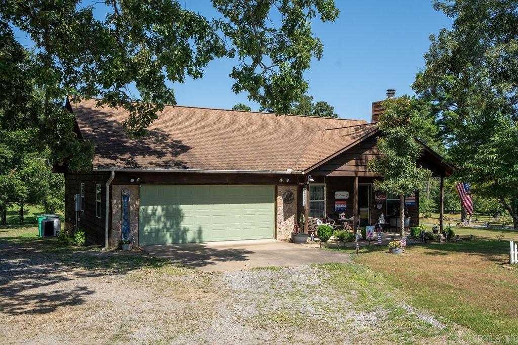 This charming custom cabin is the perfect lake getaway! Enjoy views of Greers Ferry Lake right from the dining room windows during the winter. Located less than a mile from the boat ramp and park at Cove Creek Recreation Area, it’s ideal for weekend escapes or full-time lake living. The home features beautiful wood walls and ceilings, a cozy fireplace, and a spacious deck perfect for relaxing or entertaining. With 2 bedrooms and 2 bathrooms, there’s plenty of space to unwind. The yard is beautifully maintained, offering curb appeal and peaceful outdoor space. A bonus metal carport provides ideal storage for your boat or lake toys.