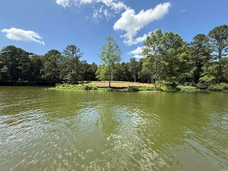 Exceptional 42-Acre Lakefront Property in Hot Springs – Endless Possibilities!  Rare opportunity to own approximately 42 acres of prime real estate located between Springwood and Majestic Lodge Road in Hot Springs, Arkansas. This unique property offers the perfect blend of serene natural beauty and development potential, featuring approximately 370 feet of lake frontage with a private boat ramp, breathtaking lake views, and a peaceful wooded setting.  Tucked away in the county for flexibility in development options—yet just minutes from downtown Hot Springs, Oaklawn, shopping, dining, and healthcare—this land offers the best of both worlds. Whether you envision building a private lakefront estate, a luxury subdivision, or a high-end RV park, this property is ready for your vision with existing roads, cleared areas for RV parking, and easy access throughout.  Key Features:  ±42 acres of scenic, wooded land  ~370 feet of lake frontage on beautiful Lake Hamilton  Private boat ramp   County location with city convenience  Roads built in and RV-accessible areas  Ideal for development, retreat, or investment  Don't miss this once-in-a-lifetime opportunity to secure a lakefront gem with u