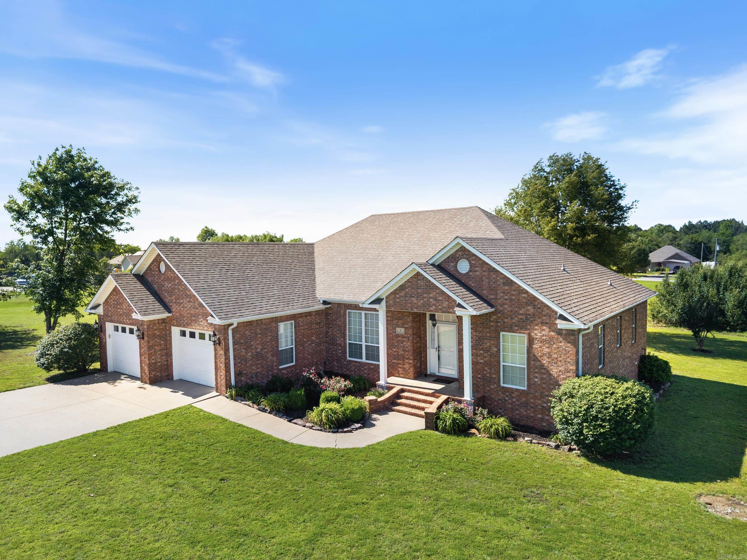 This immaculate home is located in Guy in a small subdivision with an acre of land. The home has been so well taken care of that all you need to do is move in! There is fresh coat of Snowbound paint throughout, the living room has 10' ceilings, the bedrooms have 9' ceilings, and all this is complemented by great natural light making all the rooms feel very spacious. You'll enjoy the fireplace which currently has electric logs but the fireplace also has natural gas run to the box if you would prefer to make the change. The primary suite has two separate vanities, a deep jet tub and fiberglass shower, and a built-in chest in the large walk-in closet. The home has plenty of storage even in the laundry room. The garage is oversized and has a Family Safe standing saferoom and walk-up stairs to the attic! Outside you have a nice wooden shed that's cute enough to be a playhouse. You're sure to spend many evenings on the covered back patio looking over the peaceful countryside. This is the place to be if you want to have a little space between you and your neighbors but not be isolated from people. Roof 2022