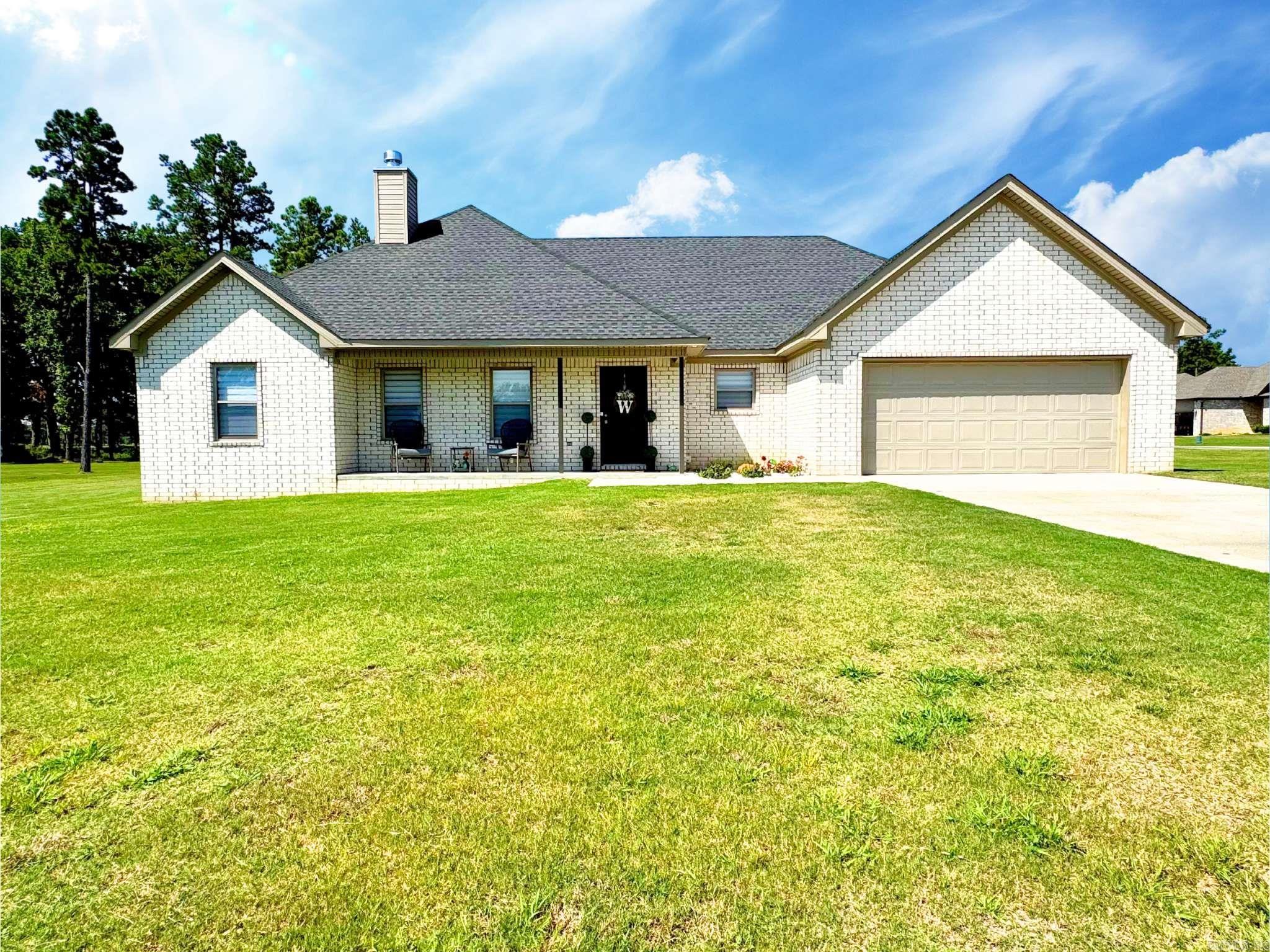 Better than new, this all-brick 3 bedroom, 2 bathroom home sits on a spacious corner lot and offers style, comfort, and convenience. The open concept layout features beautiful quartz countertops, island with storage, ceramic farm sink, stainless steel appliances, and modern finishes throughout. The primary suite includes a spa-like tiled shower with a rain head and an expansive walk-in closet. Enjoy the outdoors from your covered back porch, and let pets or kids play safely in the fully fenced yard. With thoughtful upgrades and a like-new feel, this home is move-in ready and designed for easy living. Don’t miss your chance to make it yours! Setup a showing today with your favorite REALTOR.