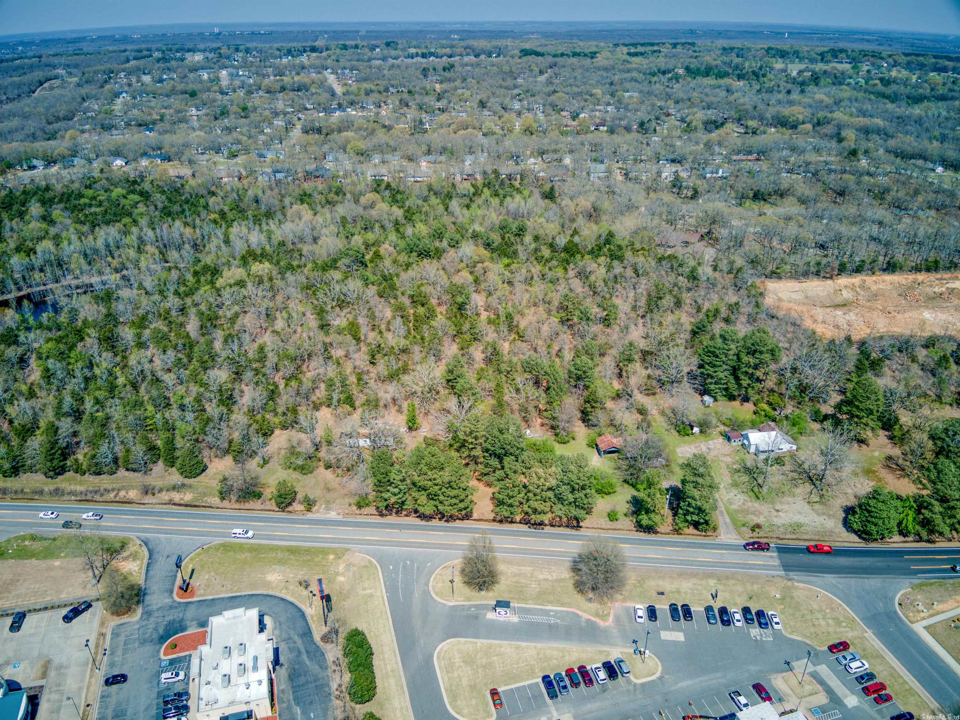 Prime commercial frontage along most traveled thoroughfare in Caobt.   22+ TOTAL Acres.  12+ Acres zoned C-2  along Main St, with an additional 10 acres zoned R-4M located behind the front acreage. Located between the future I-57 and AR HWY 5. Across the street from Centennial Bank, Adjacent to Commercial shopping center and Ford dealership.  Seconds from Wal-Mart Shopping center.  ENDLESS Possibilities.