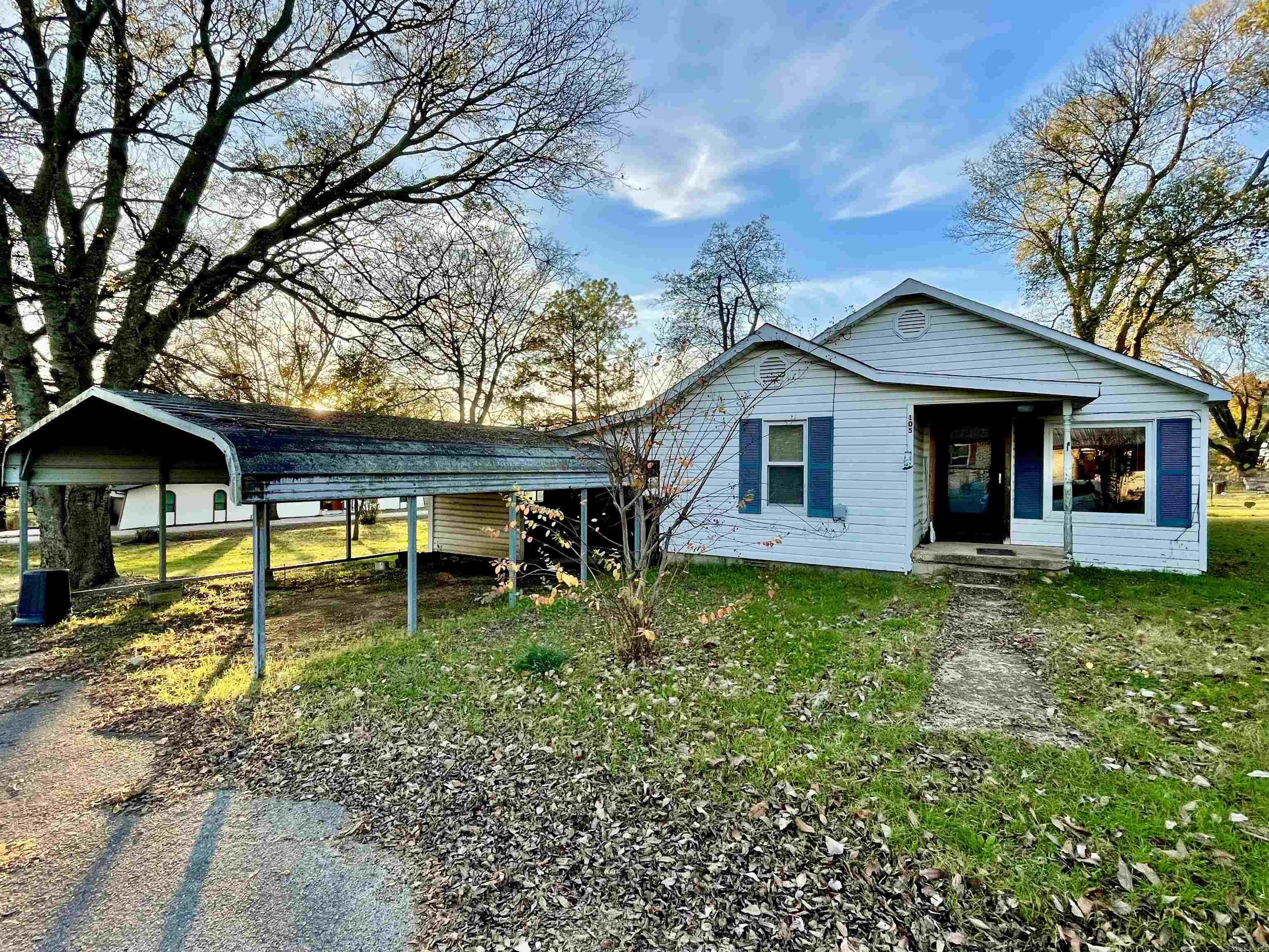 This charming home, situated on 3 city lots at the corner of South Elm and East 4th in Imboden, Arkansas, offers a fantastic investment opportunity with over 1,350 square feet of living space. Featuring 3 bedrooms and 2 bathrooms, the property is ideal for a rental, flip, or other investment ventures. The home boasts a covered back deck, a spacious carport, and a 1-car attached garage for added convenience that could double as a workshop. Two storage sheds provide extra space for tools or equipment, while several mature shade trees enhance the property's appeal and create a peaceful, inviting outdoor space. With its prime location, ample potential, and outdoor charm, this property is an excellent chance to invest or to make it your new home! Don’t miss out—schedule your showing today!