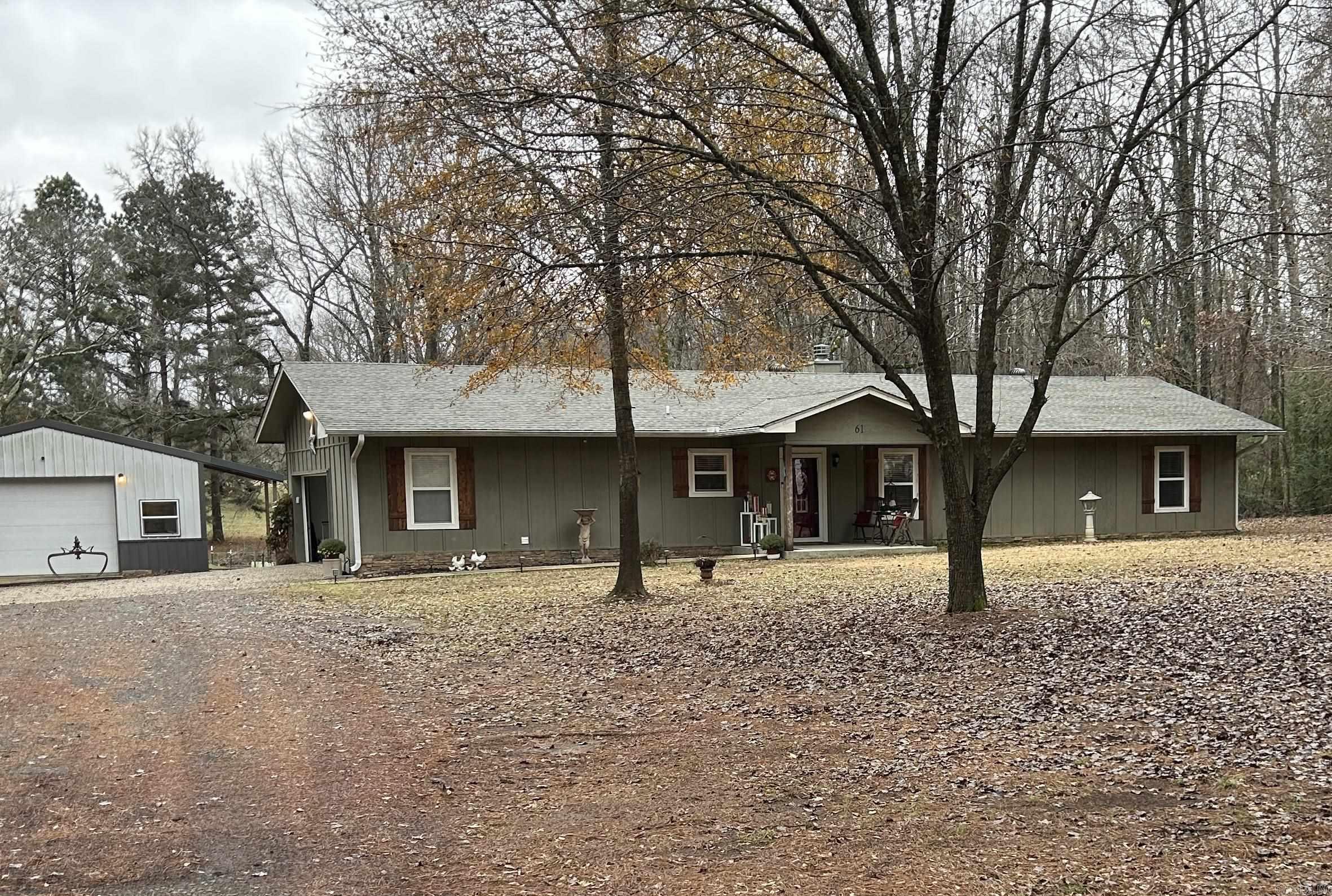 Adorable updated 3 bedroom, 2 bath home on 2.5 acres. Beautiful kitchen with granite, open to dining/living room.  Large bedrooms, plenty of room for storage.  Covered patio for entertaining or enjoying quiet time outdoors. Brand new roof! Very nice shop with electric.