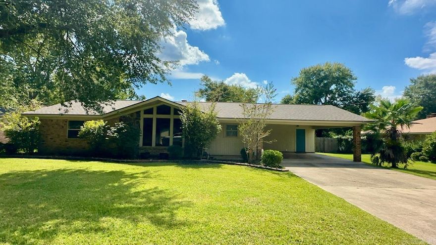 Three bedrooms and two bathrooms, with a very large living room, vaulted ceiling with painted wood beams, wood burning fireplace, large front windows, open to kitchen area, pantry and refrigerator will convey. Dining area has built in bench for storage and seating.  Primary bedroom is a great size with french doors leading out to the cozy patio. Great walk-in closet in primary.  Fenced in backyard, portable metal building will convey.  New roof 2024, water heater Dec 2022, AC unit compressor replaced in June 2023. Smart thermostat, Ring doorbell, Vivint security system (transfer to new owner).