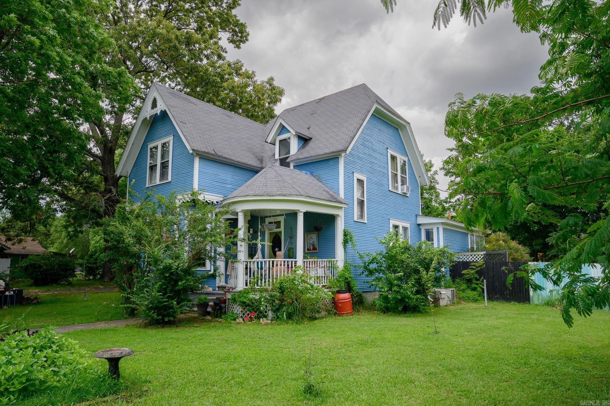 Own a piece of Mena history with this STUNNING, whimsical, one of a kind Victorian home in the heart of town! This 2-story, eclectically updated, spacious home has a 1st floor Master Suite, with 3 additional bedrooms upstairs! There is a large open concept eat-in kitchen, a pantry, a spacious separate dining room, and a separate laundry room. The downstairs bathroom has a new soaking tub and the upstairs has a vintage claw foot tub! In addition, there is a bonus room on the first floor that could easily be used as an additional bedroom, a playroom or an office! Throughout the home you’ll notice beautiful original details such as pocket doors, transom windows, hardwood floors and doors, and beautiful high ceilings. Outside there is Large fenced backyard with a well maintained shop and tiny home! There are two covered porches, a 2 car carport and a BIG front yard! If you’re yearning for a home with history, personality and unlimited potential, this is it!